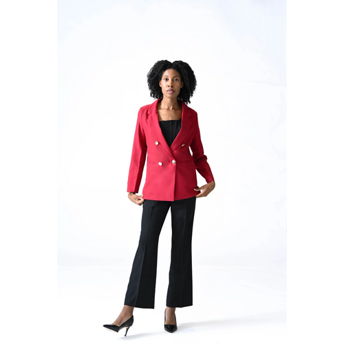 Woman wearing a red blazer and black pants on a white background